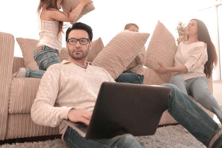 close up.a successful man working on a laptop in his homeの写真素材