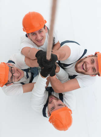 view from the top.a group of workers pulling a ropeの写真素材