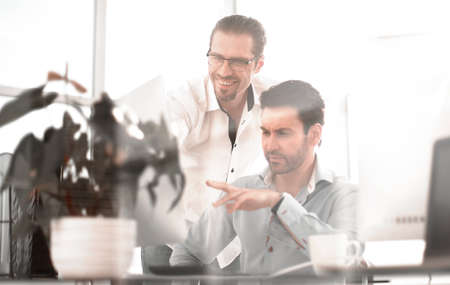 Creative designer talking with his colleague