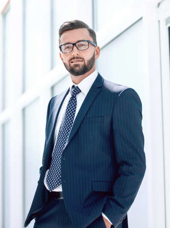 serious businessman on the background of the officeの写真素材