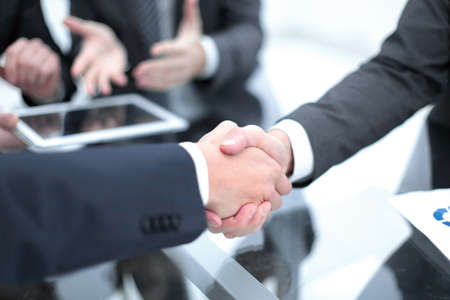 Business men shaking hands. Closeup.の写真素材