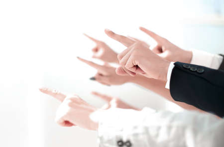 hands of business people pointing to copy spaceの写真素材