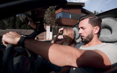 close up.young family enjoying a trip in a luxury carの写真素材