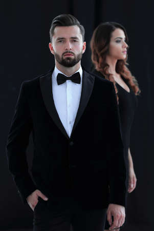 gentleman with his girl posing in the studioの写真素材