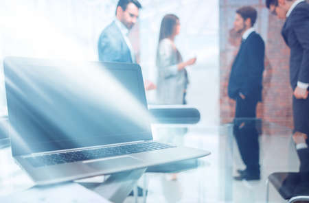 laptop with blank screen on table in modern office.の写真素材