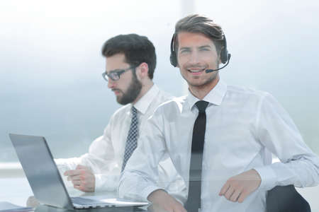 successful managers sitting at the Desk