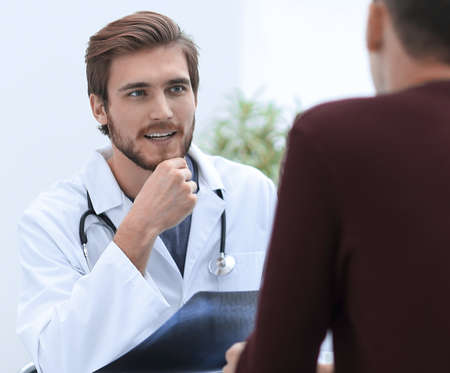 doctors discuss with the patient the x-rayの写真素材