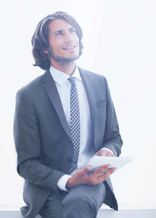 closeup .businessman with digital tablet looking at copy spaceの写真素材