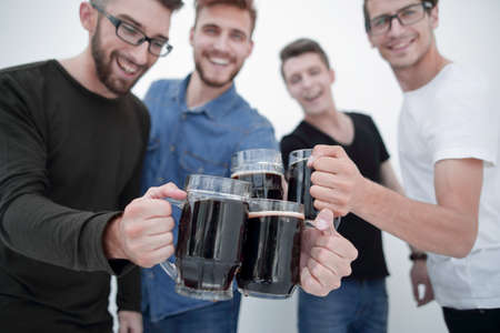guys with mugs of beer isolated on white backgroundの写真素材