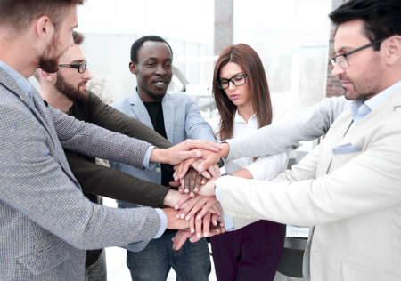 business team making a stack of hands standing