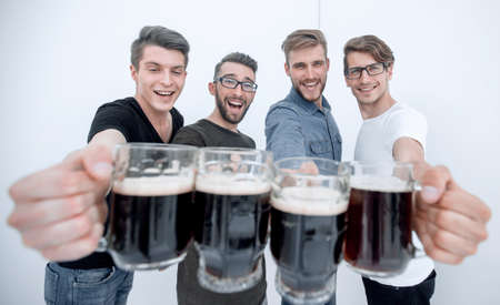 close up.mugs of beer in the hands of the fans.の写真素材