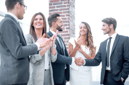 happy business team applauds new business partnersの写真素材