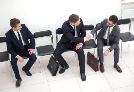 top view.handshake business people sitting in the office hallwayの写真素材