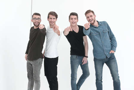 in full growth. a group of male friends are pointing at youの写真素材