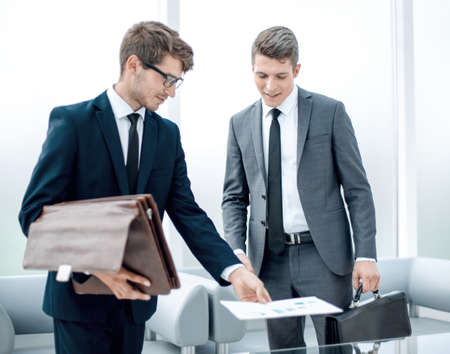 business colleagues standing in a modern officeの写真素材