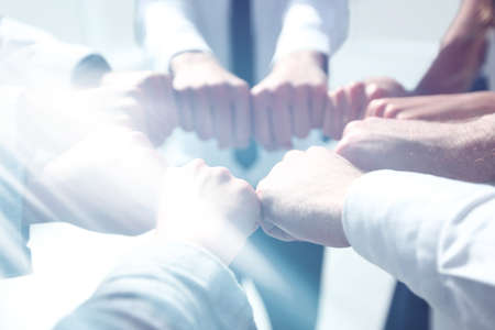 close up. business team forming a circle, out of their fists