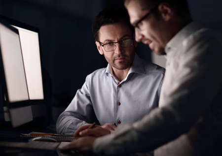 business colleagues sitting at the Deskの写真素材