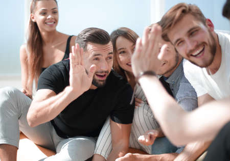 young employees giving each other a high five.の写真素材