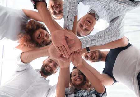 business team with hands clasped together