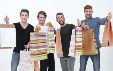 paper bags in the hands of a team of friends