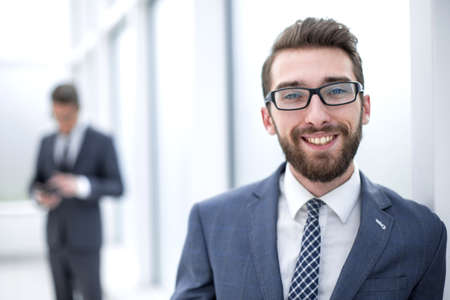 close up.businessman with glasses on the background of the officeの写真素材
