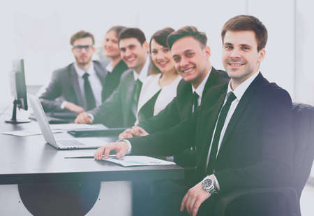 project Manager and professional business team sitting at Desk