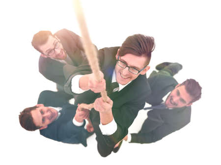 business team helping the leader to climb the ropeの写真素材