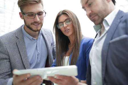 close up.employees using a digital tabletの写真素材