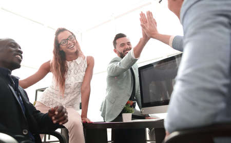 employees greet each other in the office