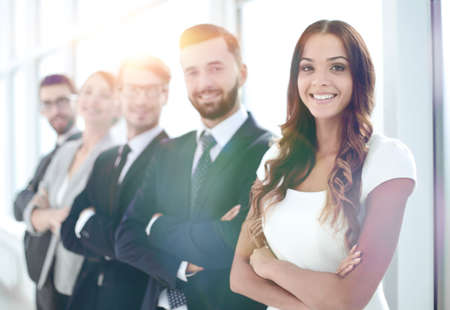 young businesswoman and business team standing together