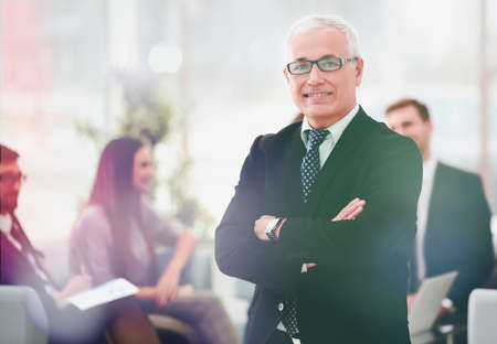 portrait of senior businessman on background of officeの写真素材