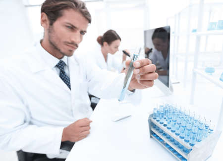 Busy group of researchers carrying out experimentsの写真素材