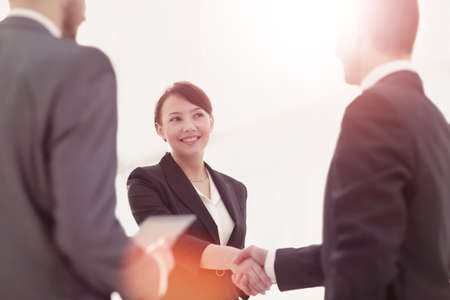 Negotiating business,Image business woman handshakeの写真素材