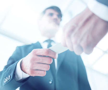 bottom view.business hands over his business cardの写真素材