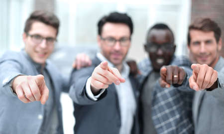 background image of business team pointing at you.の写真素材