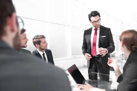 businessman holds a briefing with the business team