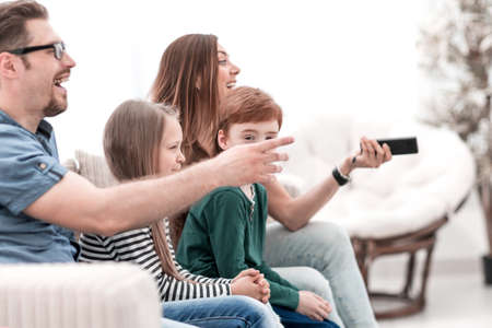 close up. young family resting in the living room in the evening