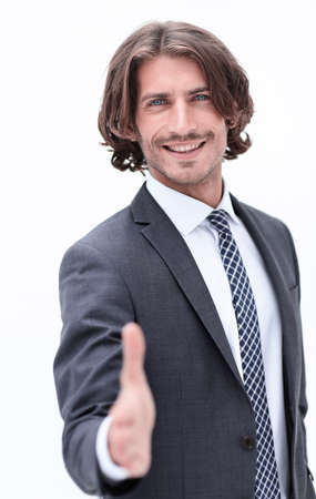 Businessman offering handshake to you on white backgroundの写真素材