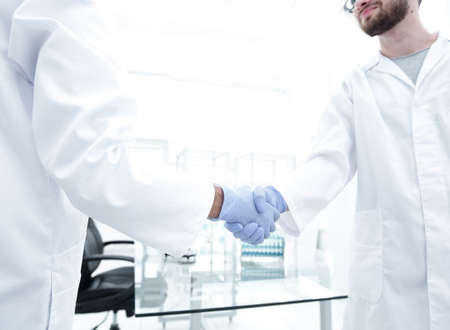 hand in the medical glove (handshake)の写真素材