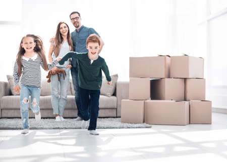 happy family having fun in a new apartment