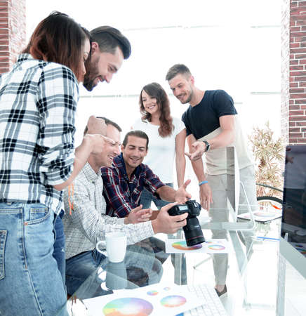group of young people talking and looking at the cameraの写真素材