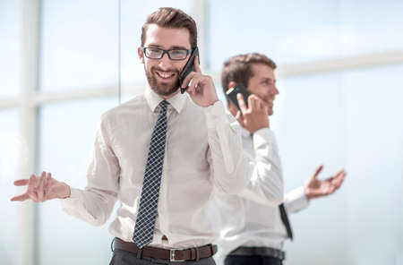 business partners communicating using smartphonesの写真素材