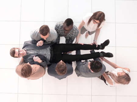 top view.a fun business team is rocking their bossの写真素材