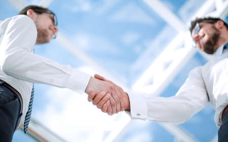 bottom view.background image of a handshake of business peopleの写真素材