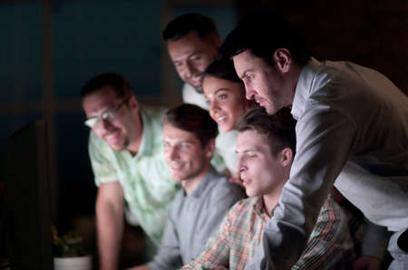 business colleagues looking at the computer screen