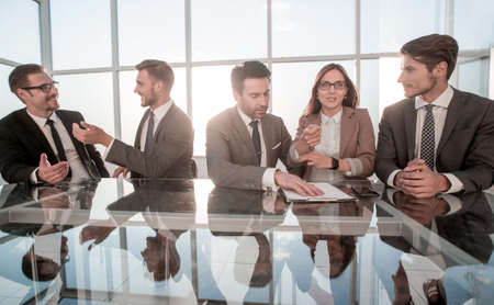 Business team using their mobile phone in the officeの写真素材