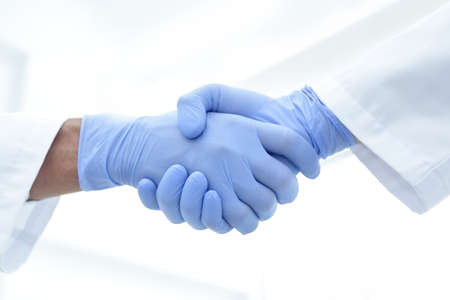 hand in the medical glove (handshake)