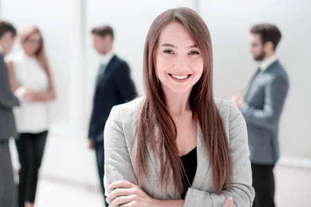 young businesswoman on a blurred background of the office