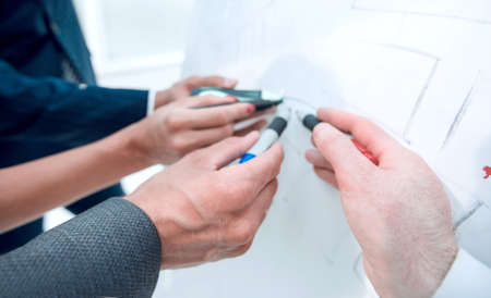 close up. the business team is discussing new ideas.the concept of teamwork