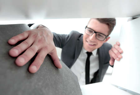 man in the office looking for documentsの写真素材